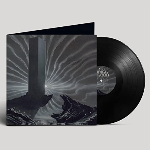 Vinyl record and album cover with a monolith and landscape scene.