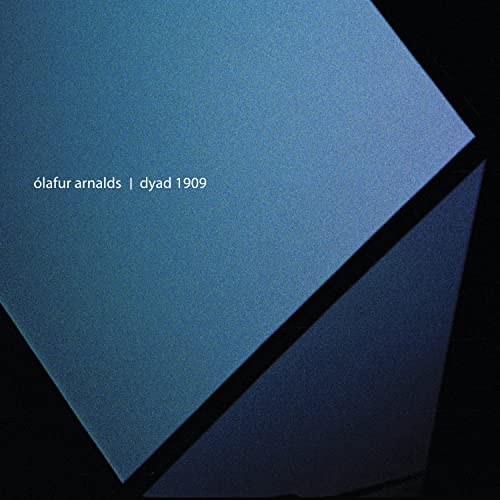 Blue vinyl record cover for Ólafur Arnalds’ “DYAD 1909”, geometric design.