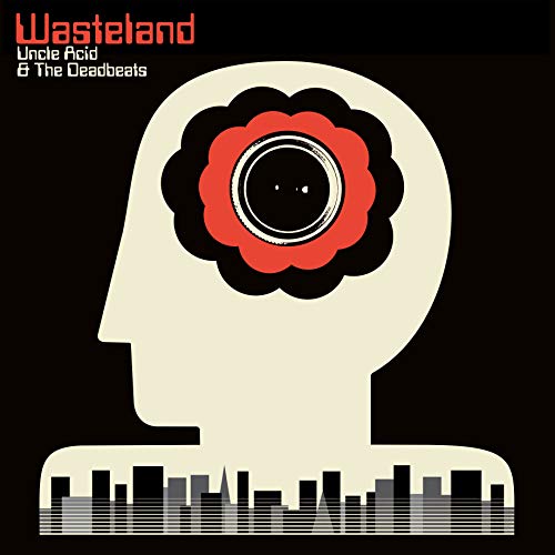 Wasteland" vinyl album cover: a beige head with a red floral eye.