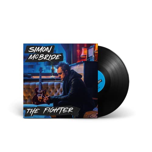 Vinyl record of Simon McBride’s “The Fighter” album with musician portrait.