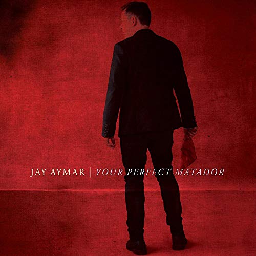 CD cover: man in suit seen from behind, red textured background.