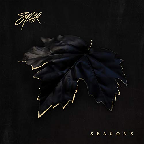 Black maple leaf with gold edges on a dark album cover.