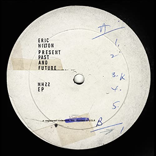 White vinyl record label with handwritten text: "Eric Hilton - Present Past and Future".