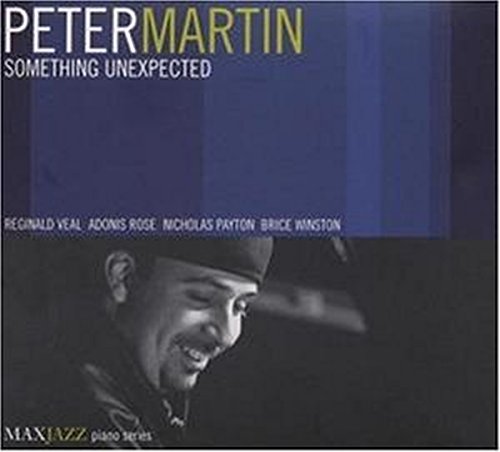 "Album cover with a man smiling, blue background, and white and yellow text."
