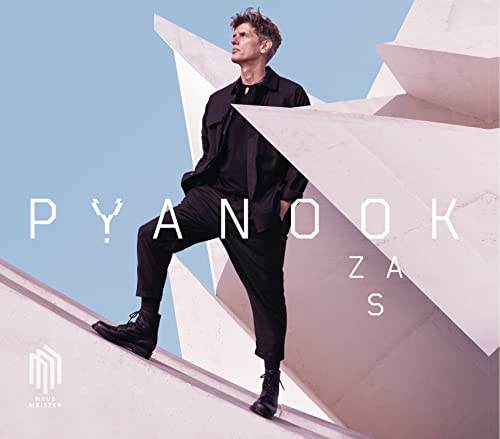 CD cover featuring a man in black clothing against geometric white shapes.