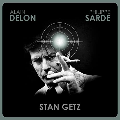 Vinyl record cover: Alain Delon with a gun, crosshairs, and waveform design.
