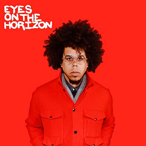 Man with curly hair and red jacket on red background with white text "Eyes on the Horizon".