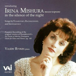 A CD cover featuring a woman with dark hair against a blue background.