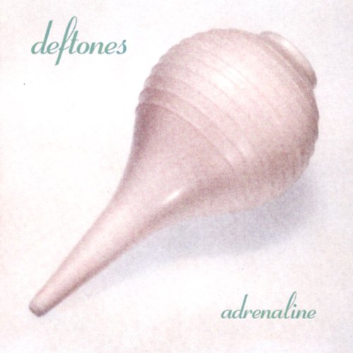 "Album cover featuring a pale pink seashell on a white background with 'Deftones Adrenaline' text."