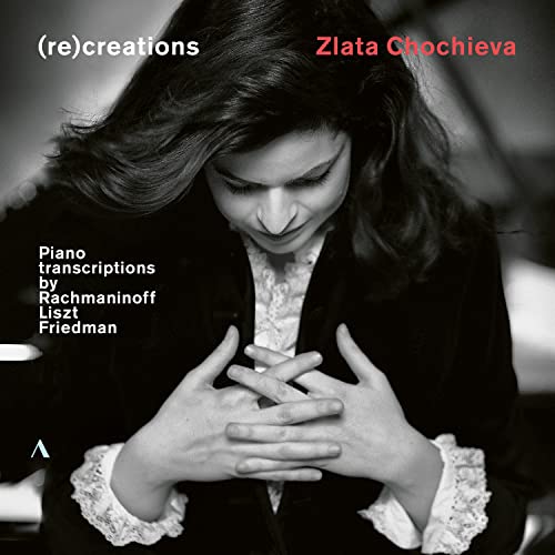 Black and white portrait of pianist Zlata Chochieva at the piano.
