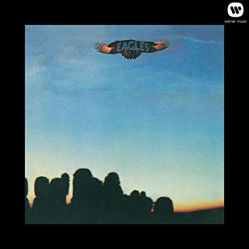 Eagles album cover: an eagle flies over silhouetted desert landscape.