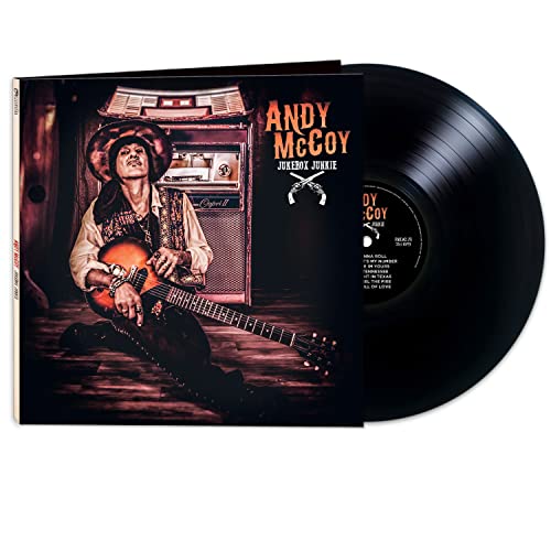Andy McCoy sitting with a guitar in front of a jukebox on vinyl record cover.