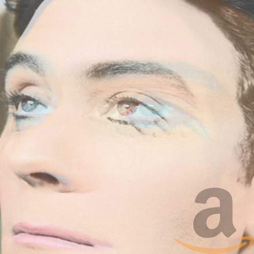 CD cover: close-up of a person’s face with blue eyeshadow.