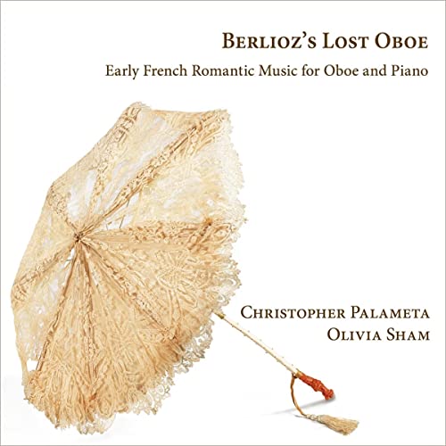 CD cover featuring a vintage lace parasol and text details.