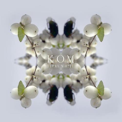 Symmetrical floral pattern with text “KOM BERRY WHITE” in the center.