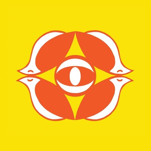 Yellow background with a symmetrical orange and white bird-eye design.