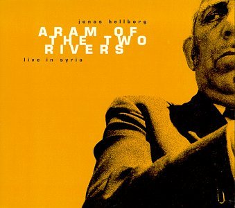 Album cover with a man in a suit against a yellow background.