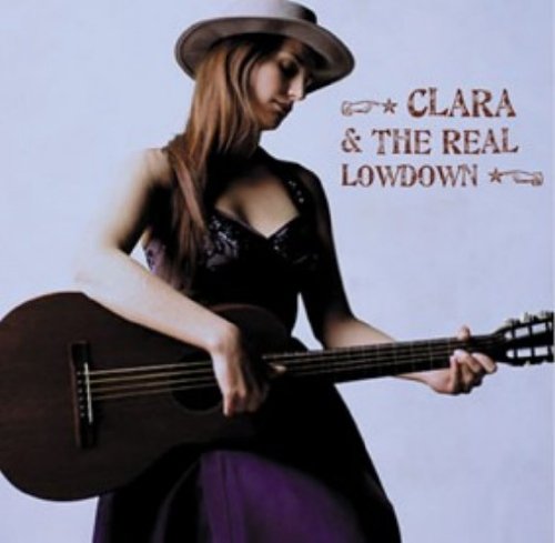 Woman with guitar and hat on album cover, light background.