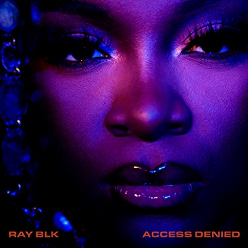 Close-up of Ray Blk with blue and red lighting, album cover.