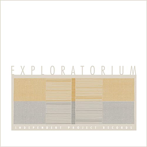 Vinyl record cover: "Exploratorium" with abstract geometric design in gold and gray.