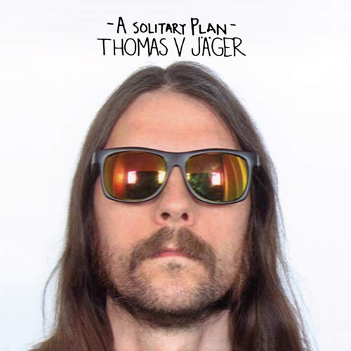 Album cover: Man with long hair and sunglasses, “A Solitary Plan.”