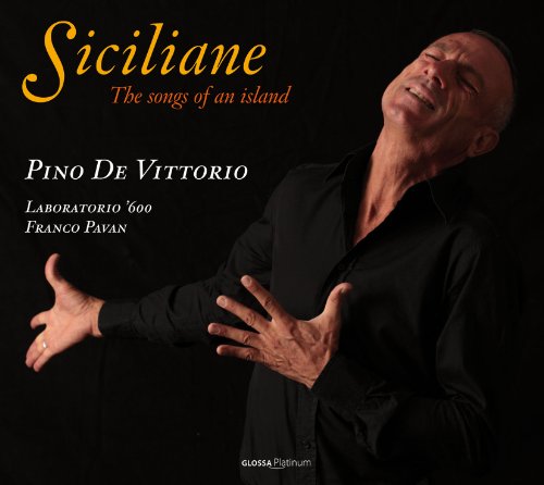 Man in black shirt, outstretched arms, and closed eyes against a black background.