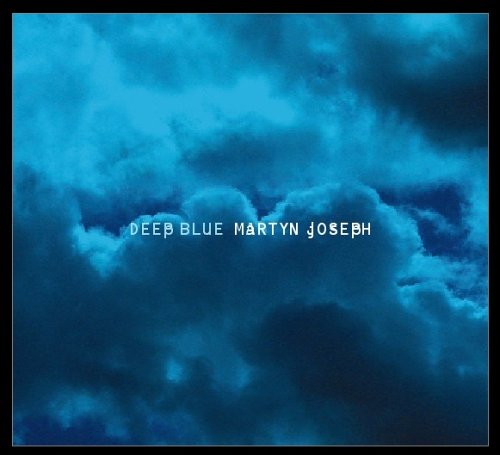 "Album cover with blue cloudy background and white text 'Deep Blue Martyn Joseph'."