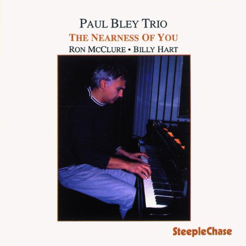 "CD cover with a man playing piano, titled 'Paul Bley Trio'."