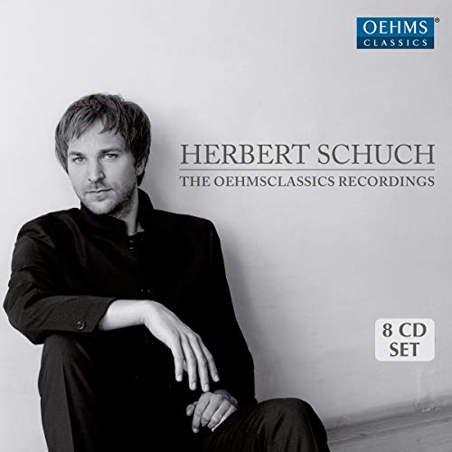 CD cover featuring portrait of pianist Herbert Schuch in a black suit.