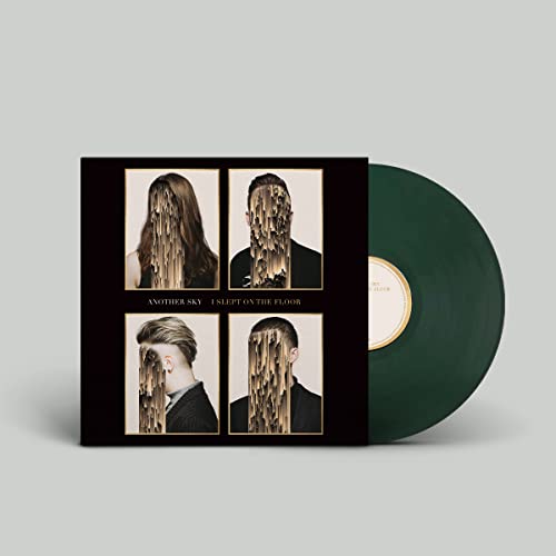 Vinyl record with album cover featuring obscured faces in gold frames.