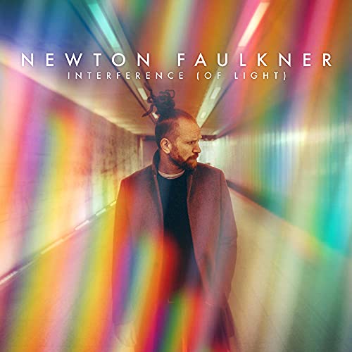 Album cover for Newton Faulkner’s “Interference (Of Light)” with a man and colorful light.