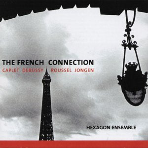 "Album cover with Eiffel Tower and lamp post against a cloudy sky, text overlay."