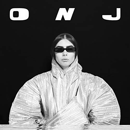 Black and white album cover featuring a woman in a metallic puffer jacket.