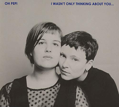 Black and white album cover featuring two women with their heads together, looking directly.