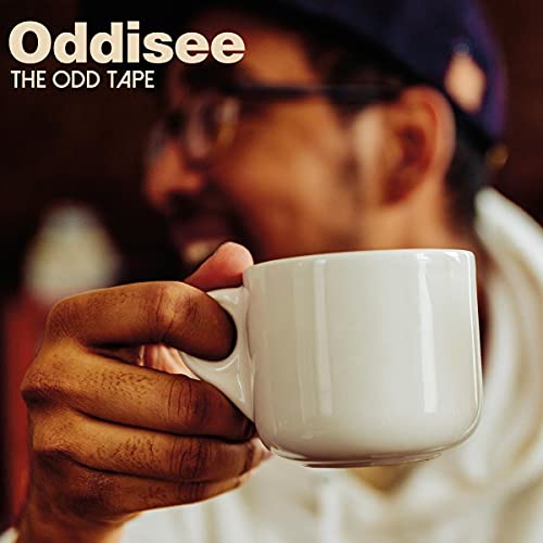 Album cover featuring a man with a mug, titled "The Odd Tape.