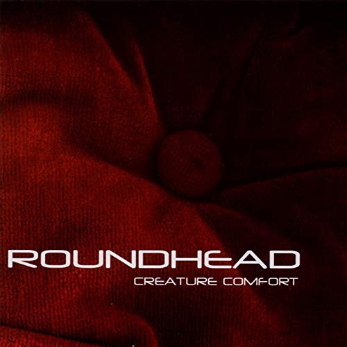 Red textured fabric with white text: "Roundhead - Creature Comfort".
