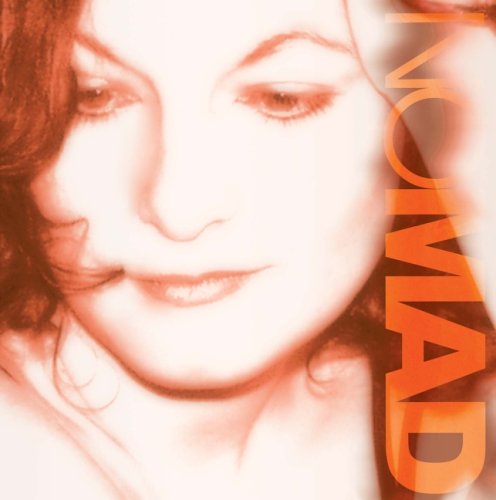 "Album cover with a woman's face and 'NOMAD' text on the right side."