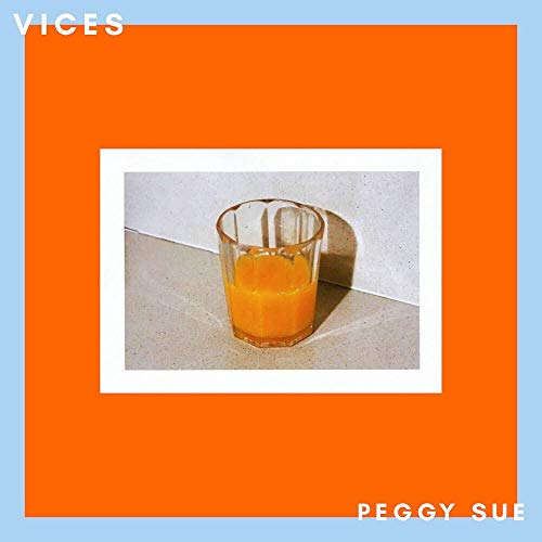 A glass of orange liquid on a stone surface, surrounded by an orange and blue border.