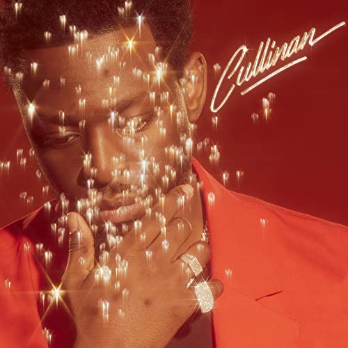 Dadju album cover, portrait with sparkling effects and handwritten title.