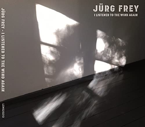 CD cover: shadows on a wooden floor, text “I Listened To The Wind Again”.