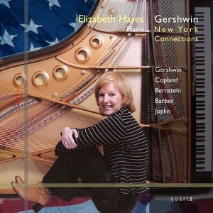 CD cover featuring a blonde woman sitting inside a piano with an American flag.