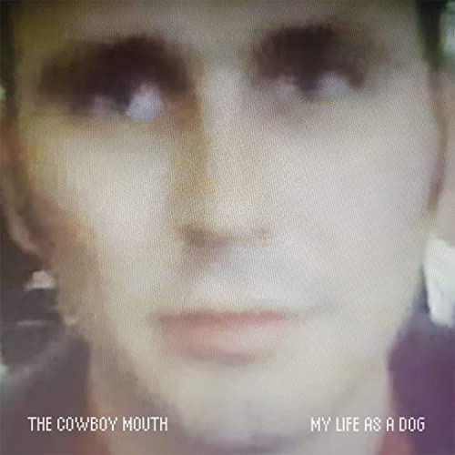Blurred portrait of a person with text: "The Cowboy Mouth" and "My Life As A Dog".