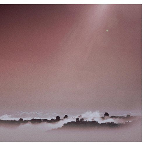 The image shows a pinkish-brown album cover with a misty landscape and a small white dot.