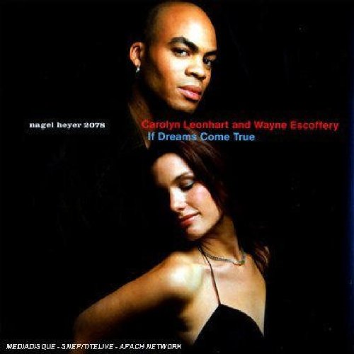 Album cover featuring a man and woman against a black background.