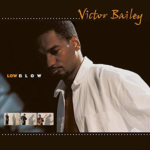 "Album cover featuring Victor Bailey, a man in a white shirt, against a dark background."