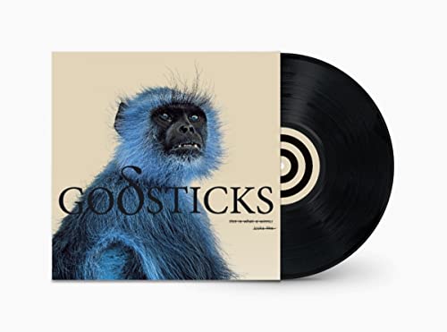 Vinyl record with album cover featuring a blue monkey portrait.