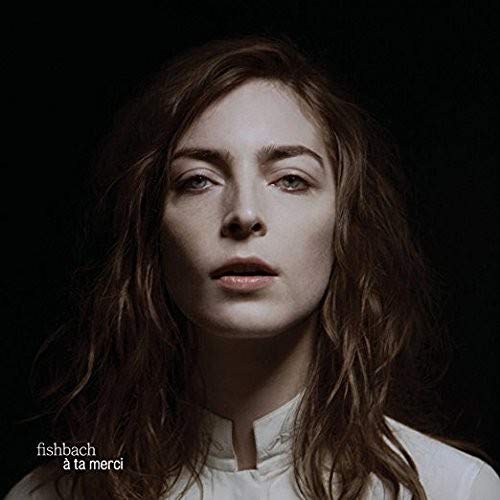 Close-up portrait of a woman with long hair, album cover art.