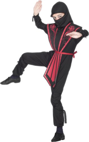 A child in a black ninja costume with red trim poses on a white background.