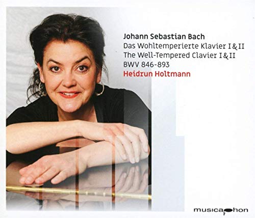 CD cover featuring a woman resting her arms on a piano with text.