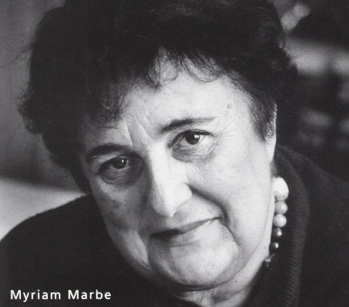 Black and white portrait of an older woman with short dark hair.